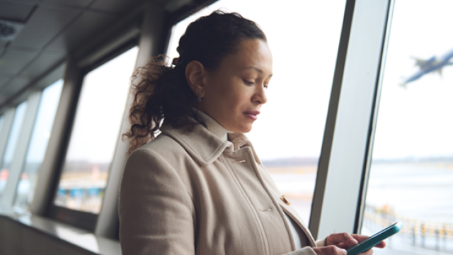 Lady on her phone boarding a plane