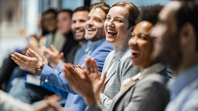 People clapping at an event