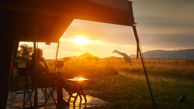 Man watching the African sunset