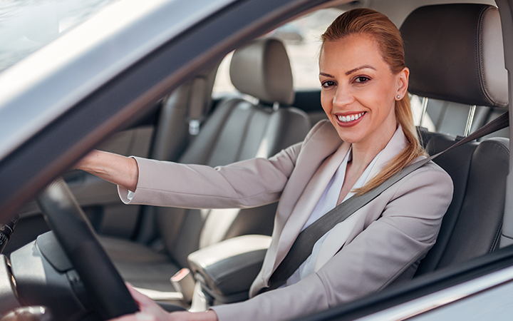 Business traveller seated in a car