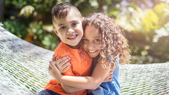 Two children hugging